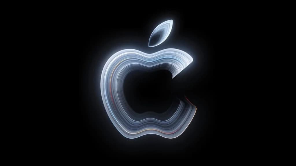 ภาพทีเซอร์ Pro and Tell ของ Apple เป็นโลโก้เรืองแสงซ้อนชั้นบนพื้นดำ